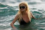 Paris Hilton - Bikini candids - Surfing-3.jpg