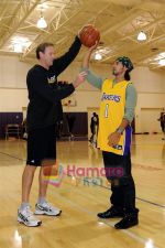 Asst Coach Kurt Rambis teaches NBA tricks to Dino Morea in The Staples Center, Los Angeles, California on 23rd November 2008.JPG