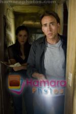 Nicolas Cage, Rose Byrne in still from the movie Knowing (2).jpg