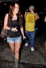 Miley Cyrus leaving Katsu-Ya sushi restaurant with friends in Studio City, California on 25th August 2009 - IANS-WENN (8).jpg