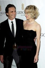 Lawrence Bender and Meg Ryan attend the de Grisogono party at the Hotel Du Cap on May 18, 2010 in Cap D_Antibes, France (3).JPG