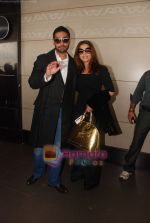 Abhishek Bachchan, Aishwarya Rai leave for london raavan premiere (11).JPG