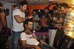 John Abraham,  Mahendra Singh Dhoni style each other at Mad-o-wat salon in Bandra, Mumbai on 4th Dec 2010 (10).JPG