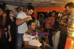 John Abraham,  Mahendra Singh Dhoni style each other at Mad-o-wat salon in Bandra, Mumbai on 4th Dec 2010 (16).JPG