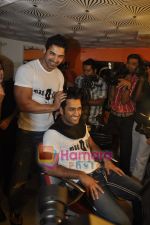 John Abraham,  Mahendra Singh Dhoni style each other at Mad-o-wat salon in Bandra, Mumbai on 4th Dec 2010 (8).JPG
