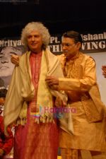 Pt. Bhima Shankar honouring Pt. Shivkumar sharma at Nrityacharya Pt.Gaurishankar Foundation_s The Living Legend in Mumbai on 27th Feb 2011.JPG