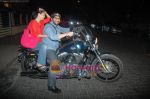 Arshad Warsi on his Harley bike with wife Maria as they went to watch The King_s Speech on 8th March 2011 (8).JPG