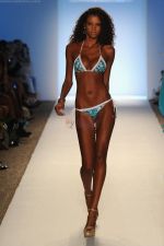 A model walks the runway for the Caffe Swimwear show during Mercedes-Benz Fashion Week Swim 2012 at The Raleigh on July 16, 2011 in Miami Beach, Florida (3).JPG