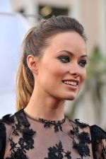 Olivia Wilde arrives at the world premiere of the movie Cowboys and Aliens at San Diego Civic Theatre on July 23, 2011 in San Diego, California (4).jpg
