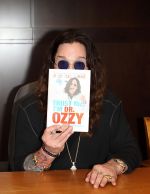 Ozzy Osbourne signs his book _Trust Me, I_m Dr. Ozzy_ at Barnes and Noble at The Grove in Los Angeles on October 15, 2011 (1).jpg