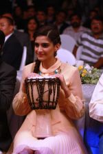 Sonam Kapoor playing the African drum at new range launch of Spice Mobiles in Mumbai.jpg