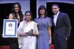 Asha Bhosle receives the Guinness World Records certificate in London.jpg