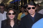 Madhuri dixit snapped with husband in Mumbai Airport on 6th April 2012 (11).jpg