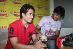 Ritesh Deshmukh, Tusshar Kapoor with dog Macho on the sets of Radio Mirchi to promote Kya Super Kool Hain Hum in Lower parel, Mumbai on 25th June 2012 (31).JPG
