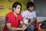 Ritesh Deshmukh, Tusshar Kapoor with dog Macho on the sets of Radio Mirchi to promote Kya Super Kool Hain Hum in Lower parel, Mumbai on 25th June 2012 (32).JPG