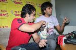Ritesh Deshmukh, Tusshar Kapoor with dog Macho on the sets of Radio Mirchi to promote Kya Super Kool Hain Hum in Lower parel, Mumbai on 25th June 2012 (34).JPG