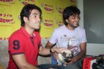 Ritesh Deshmukh, Tusshar Kapoor with dog Macho on the sets of Radio Mirchi to promote Kya Super Kool Hain Hum in Lower parel, Mumbai on 25th June 2012 (35).JPG