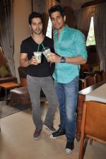 Varun Dhawan, Siddharth Malhotra at Student of the year launch Starbucks new shop in Mumbai on 24th Oct 2012 (171).JPG