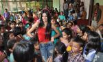 Sherlyn Chopra First Indian Playboy Cover Girl turns Santa for street kids of The Ray of Hope NGO in Mumbai on 16th Dec 2012 (3).JPG