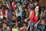 Sherlyn Chopra First Indian Playboy Cover Girl turns Santa for street kids of The Ray of Hope NGO in Mumbai on 16th Dec 2012 (9).JPG