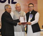 Annu Kapoor collected his National Award from President Pranab Mukherjee on 3rd May 2013 (2).jpg
