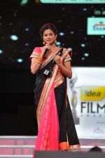 Priyamani receives the Best Actor - Female award for the movie Charulatha from Lakshmi Manchu and Jagapathy Babu during the 60th Filmfare Awards..jpg