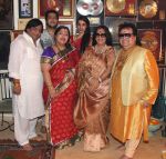 Row 1. Govind Bansal, Rema Bansal, Chitrani lahiri, Bappi Lahiri Row 2. Bappa Lahiri & Tanisha Verma Lahiri at Bappi Lahiri_s Ganpati celebrations in Mumbai on 9th Sept 2013.jpg