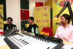 Aamir Khan, Abhishekh Bachchan and Uday Chopra at Radio Mirchi studio for promotion of their upcoming movie Dhoom 3_52b16d66963e0.JPG