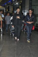 Karan Johar, Manish Malhotra arrive back in Mumbai post new year celebrations in Mumbai on 2nd Jan 2014 (40)_52c65665047c9.JPG