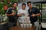 Olympian Swimmer Rehan Poncha, HP Founder Rohan Mirchandani, Actor Tanuj Virwani at the Launch of Hokey Pokey Ice-creams in Retail Packs on 26th April 2014 (1)_535e043ca8a76.jpg