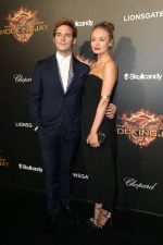 0517_Claflin_Haddock_at_Hunger-Games_party_with_Chopard _537f2f814363a.jpg