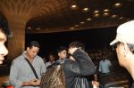 Shahrukh Khan with son snapped at airport in Mumbai on 25th Aug 2014 (5)_53fc93b8c56b0.JPG
