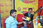 Siddharth Anand & Hrithik Roshan at Radio Mirchi studio for the success of Bang Bang!_543cd4bddfb00.jpg