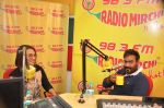 Sonakshi Sinha & Ajay Devgn at Radio Mirchi Mumbai studio for the promotion of upcoming movie Action Jackson (4)_547ea4916c22c.JPG