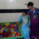Asha Bhosle and Dr.Anjali Morris with kids at the inauguration of Small Steps Morris Autism and Child Development Centre at Deenanath Mangeshkar Hospital  _54fd8ec43a50a.jpg