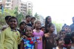  Poonam Pandey Distribute Raincoat To Neddy Kids on 30th May 2017 (24)_592ebf0397ea4.JPG