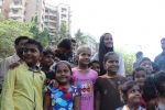  Poonam Pandey Distribute Raincoat To Neddy Kids on 30th May 2017 (25)_592ebf0537c24.JPG