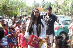  Poonam Pandey Distribute Raincoat To Neddy Kids on 30th May 2017 (37)_592ebf1a0a7f2.JPG
