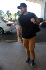 Fardeen Khan wearing sunglasses, black shirt, khaki pants, blue nike shoes and black Nike hat (8)_646f34872f810.jpg