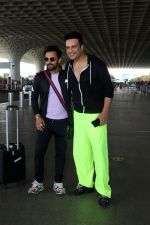 Krushna Abhishek in a black laced coat and fluorescent green pants and black sneakers (10)_64718da254592.jpg