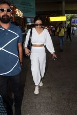 Malaika Arora in white wearing dark glasses white sneakers and holding black Chanel Bag  (4)_64744778bddab.jpg