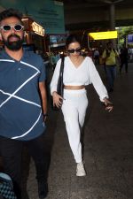 Malaika Arora in white wearing dark glasses white sneakers and holding black Chanel Bag  (5)_647447720c5d0.jpg