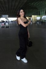 Nikki Tamboli wearing all black strapless bodycon dress, white sneakers holding Tamboli holding Chanel Black Quilted Lambskin Small Trendy Top Handle Flap Bag (11)_64746dfd27ccc.jpg
