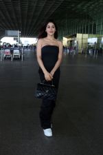 Nikki Tamboli wearing all black strapless bodycon dress, white sneakers holding Tamboli holding Chanel Black Quilted Lambskin Small Trendy Top Handle Flap Bag (18)_64746e324cda6.jpg
