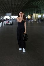 Nikki Tamboli wearing all black strapless bodycon dress, white sneakers holding Tamboli holding Chanel Black Quilted Lambskin Small Trendy Top Handle Flap Bag (6)_64746de0cf068.jpg