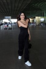Nikki Tamboli wearing all black strapless bodycon dress, white sneakers holding Tamboli holding Chanel Black Quilted Lambskin Small Trendy Top Handle Flap Bag (9)_64746df32a745.jpg