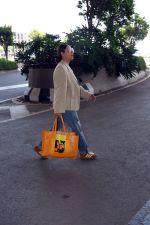 Gauahar Khan holding Villette Tote Bag wearing Gazelle Gucci Mesa White Red shoes, Balmain distressed effect finish jeans, overcoat and sunglasses (2)_6475d37f3c98c.jpg