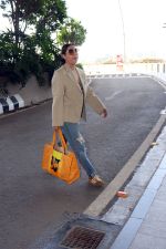 Gauahar Khan holding Villette Tote Bag wearing Gazelle Gucci Mesa White Red shoes, Balmain distressed effect finish jeans, overcoat and sunglasses (3)_6475d3731f36f.jpg