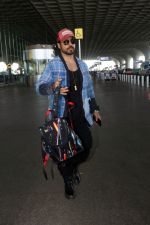Gautam Gulati holding Christian Louboutin Explorafunk Backkpack dressed in Black with a red cap and blue jacket (1)_6475d82d506c7.jpg
