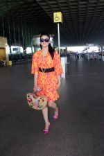 Urvashi Rautela dressed in a pink and orange floral dress spotted at airport on 14 Jun 2023 (1)_6489cf68abe5c.jpg